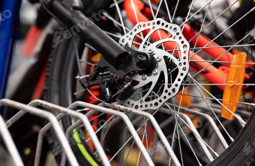Preview: Part of road Bike brake disc in close up. Bicycle shop maintenance technical expertise. details bike