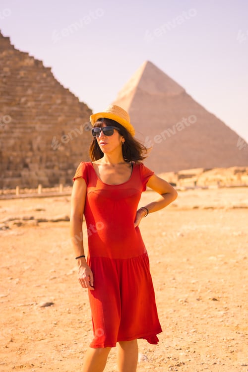 Preview: Portrait Of A Young Girl In Red Dress At The Pyramid Of Cheops The Largest Pyramid. The Pyramids Of