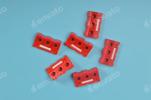 Preview: Red safety barricades isolated on a blue background.