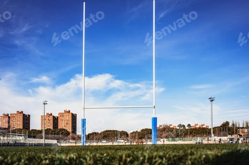 Preview: Background of a rugby goal casting shadows on the field.