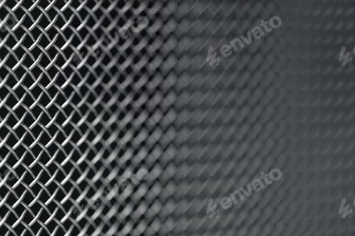 Preview: Metal grill close-up, texture of a music speaker, soft focus.