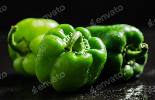 Preview: Fresh sweet pepper. On black table.