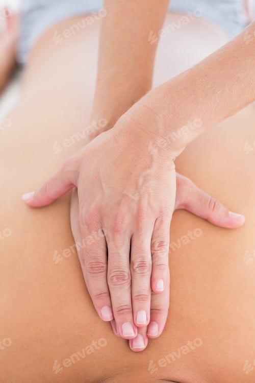 Preview: Physiotherapist Doing Back Massage To Her Patient In Medical Office