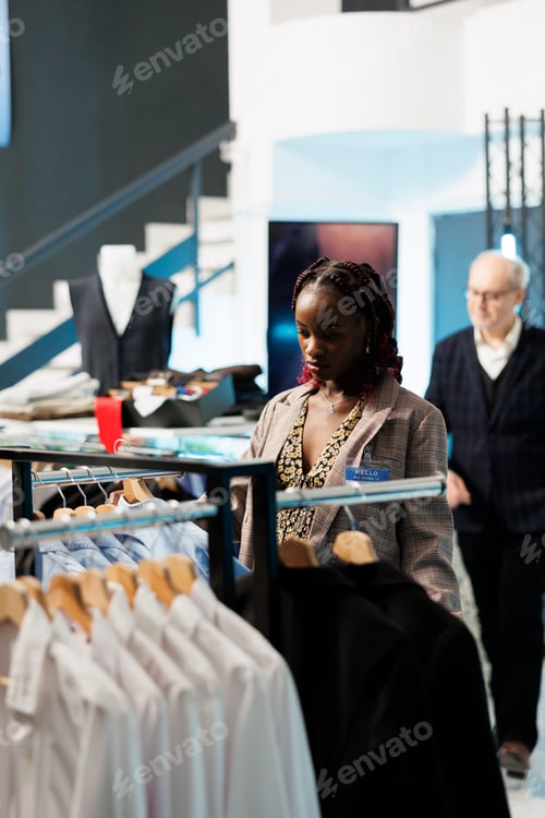 Preview: Pregnant client looking at trendy clothes on hangers