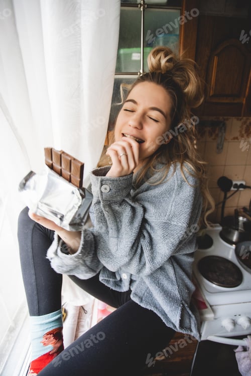 Preview: Woman Enjoys Chocolate Indoors by Window