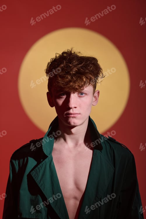 Preview: Portrait of Young Man Standing Against Vibrant Background