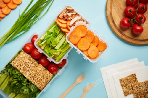 Preview: flat lay with cutlery and healthy food composition isolated on blue