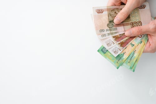 Preview: Concept finance, payment, poverty. Hands holding money on white background, copy space.