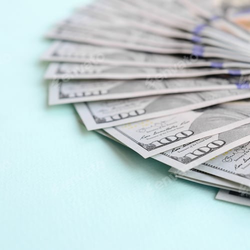 Preview: One Hundred Dollar Bills Stacked on Pale Blue