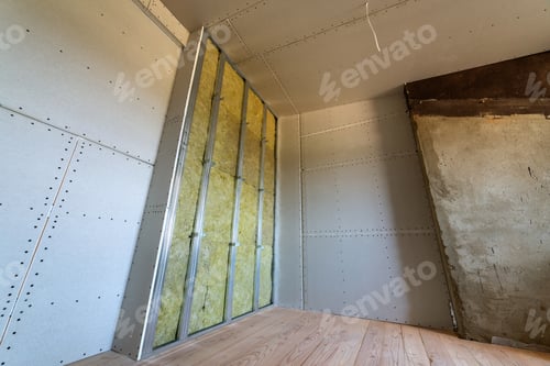 Preview: Wall of a room under renovation with mineral rock wool insulation and metal frame prepared for