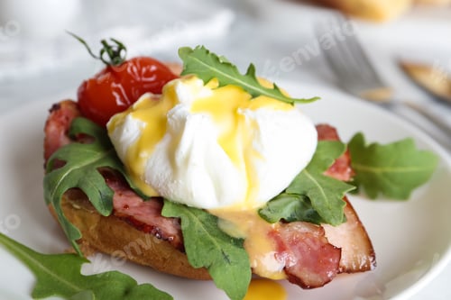 Preview: Delicious egg Benedict served on plate, closeup