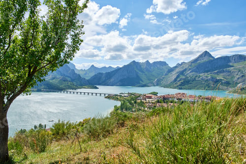 Preview: Riano village in Leon Spain with lake and mountains in the background on a sunny day