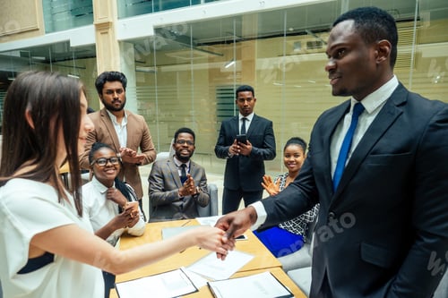 Preview: well-dressed business afro american men making a report to subordinate employees in a modern office