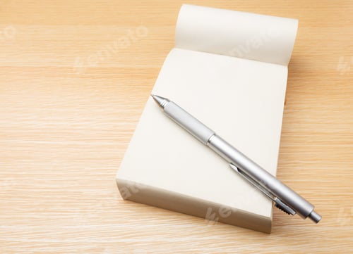 Preview: Memo pad and pen on the table