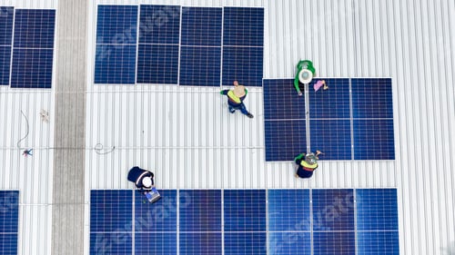 Preview: Aerial view of a rooftop with solar panels, showing a technician in safety performing maintenance.