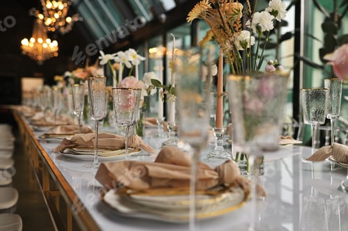 Preview: beautiful elegant decor of flowers and elegant serving on the wedding table.