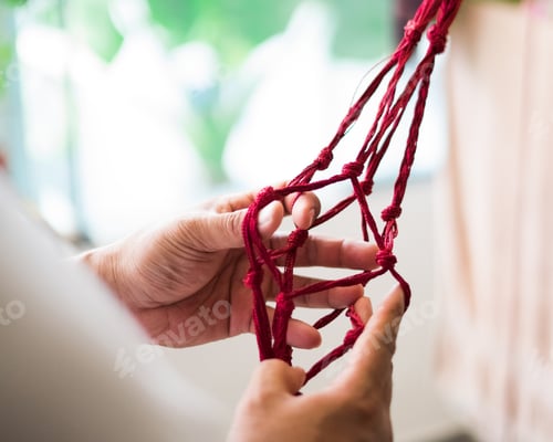 Preview: NOMINATED hands working on macrame tying.