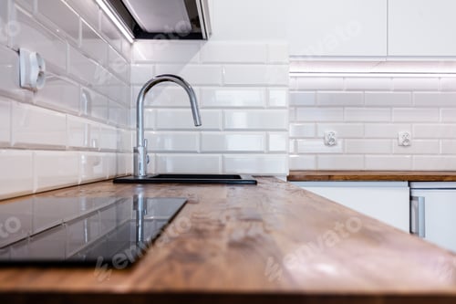 Preview: New clean kitchen with wooden table top