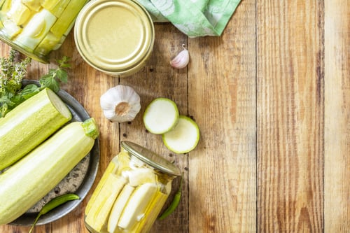 Preview: Healthy homemade fermented food. Pickled zucchini with mint preserved canned in glass jar.