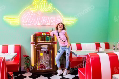Preview: stylish smiling woman in retro vintage cafe