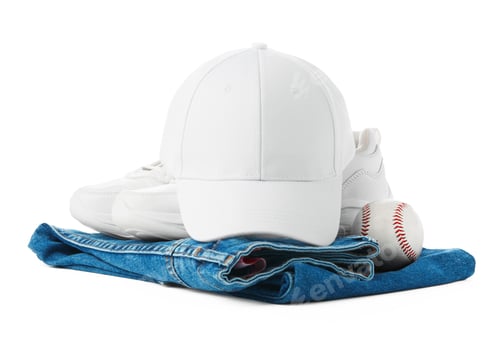 Preview: White Shoes and Baseball Cap on Top of a Pair of Jeans