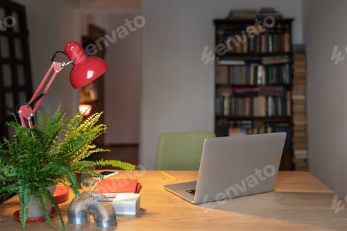 Preview: Home office setup for remote working, Cozy workplace with laptop, desk lamp and office supplies