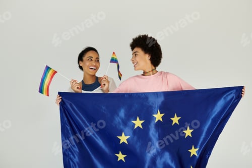 Preview: Celebrating unity and diversity with european and pride flags in a joyful portrait