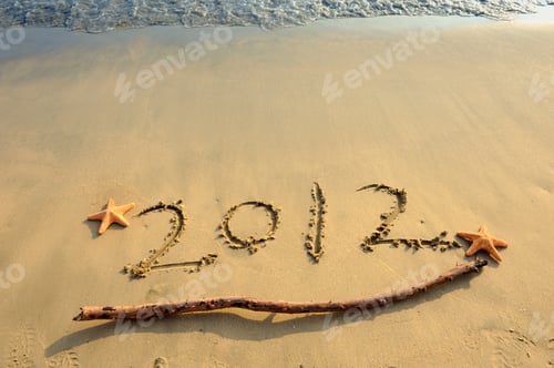 Preview: Inscription "2012" On A Beach Sand With Starfish