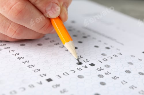 Preview: Student fills answers test sheet, close up