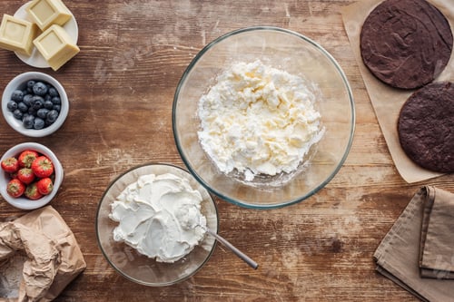 Preview: top view of ingredients for dough and cream on wooden table