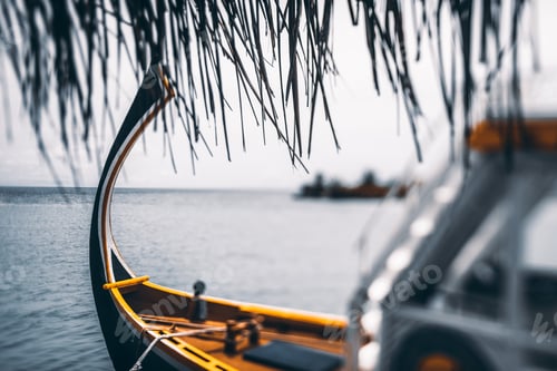 Preview: Tiltshift view of a colorful boat near a warf