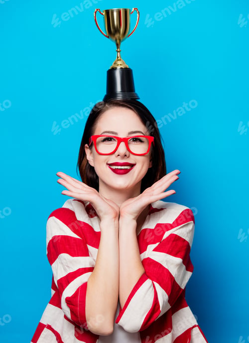 Preview: young smiling woman with cup trophy