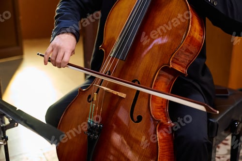 Preview: Cellist performing a soulful piece in a tranquil church setting