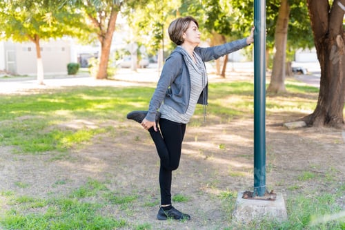 Preview: Side View Of Retired Elderly Woman Exercising Outdoors