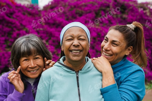 Preview: Happy elderly female friends having fun together at city park