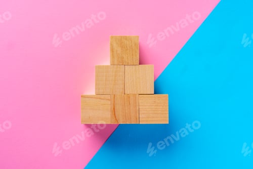Preview: Top view photo of wooden blocks on pink and blue
