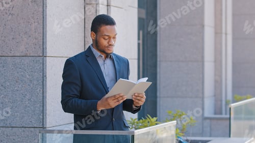Preview: African American man ethnic businessman employer entrepreneur office worker standing on balcony