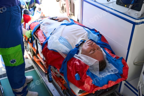 Preview: Patient on a stretcher is loaded into an ambulance