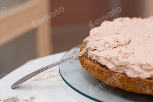 Preview: Working process of baking cake at home. Close up of chocolate biscuit sliced with cream. Culinary