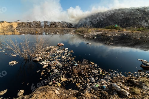 Preview: Landfill with burning trash piles