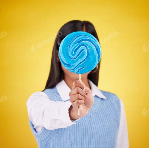 Preview: cover, lollipop and candy with woman in studio for sweets, colorful snack and food. Treats, dessert