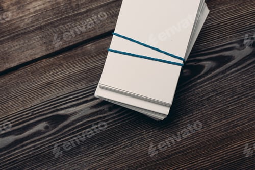 Preview: bundles of business cards on a wooden background top view work finance