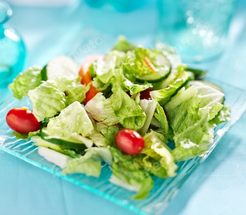 Preview: Garden salad with fresh vegetables on glass plate.