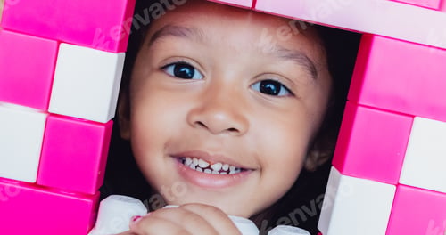 Preview: Beautiful little girl, building with blocks, window, opening, pretend play, mixed race