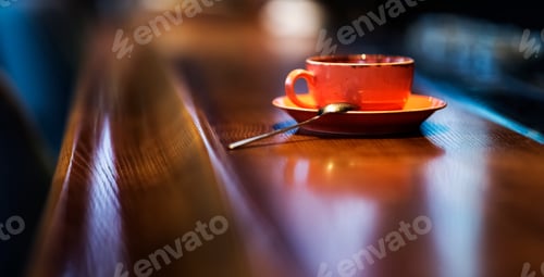 Preview: Soft focused image. Cup of espresso on wooden table of cafeteria