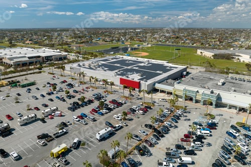 Preview: Large parking lot with many parked cars. Big carpark at supercenter shopping mall