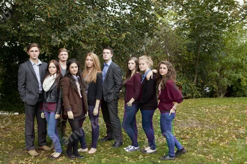 Preview: Students standing together in park