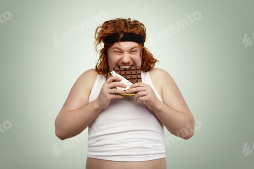Preview: Crazy and hungry overweight young redhead European male with good appetite wearing black sports bra