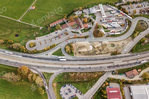 Preview: Top down aerial view of freeway interstate road with moving traffic cars in rural area.