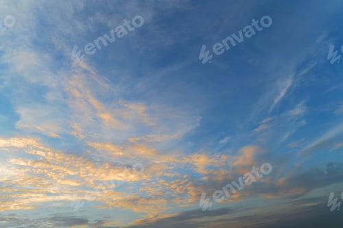 Preview: Sunset sky. Abstract nature background. Dramatic blue and orange, colorful clouds at twilight time.